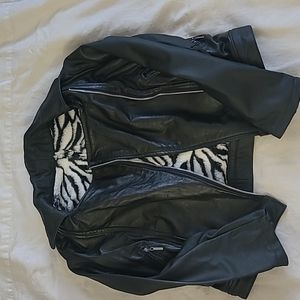 Leather jacket, black  in color, and zebra color  from the inside .